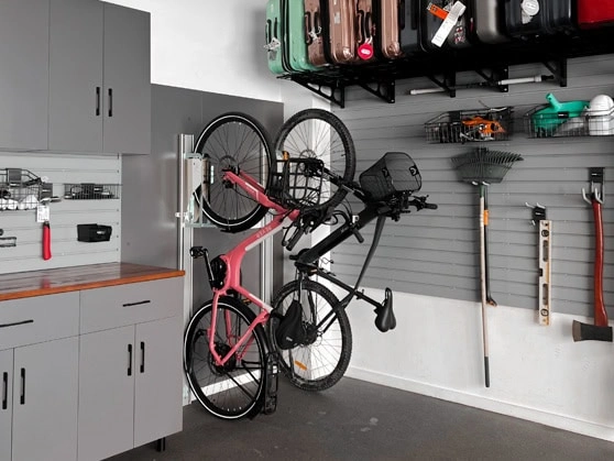 Garage with kayaks, bikes and garden tools on the wall