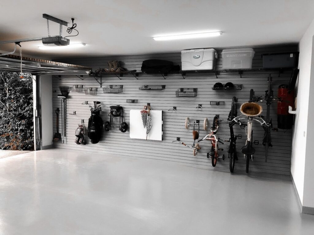 Grey garage storage cabinets with timber benchtop