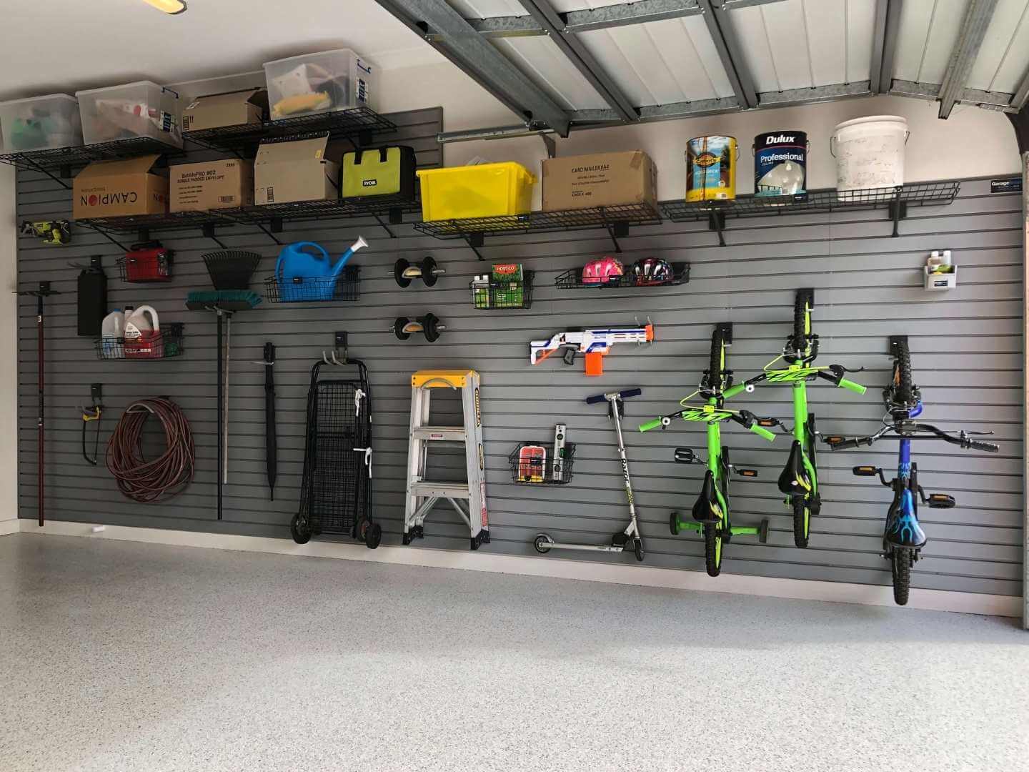 The same garage after the fit out, bikes and gear on the slatwall